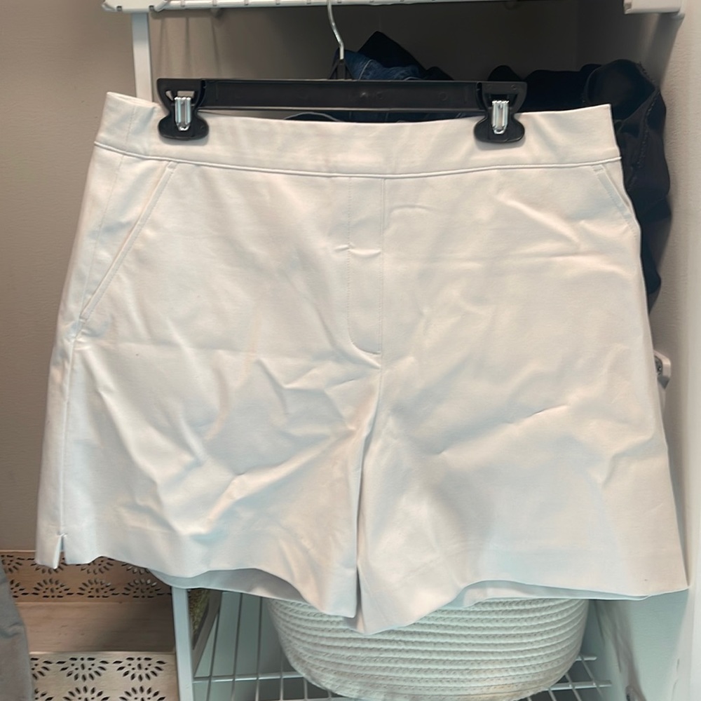 SPANX white  on the go 6” shorts with silver lining technology. Never worn.
